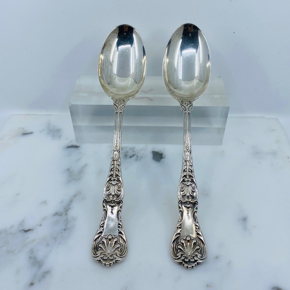 Antique 2 hallmarked heavy sterling silver ornate serving spoons.